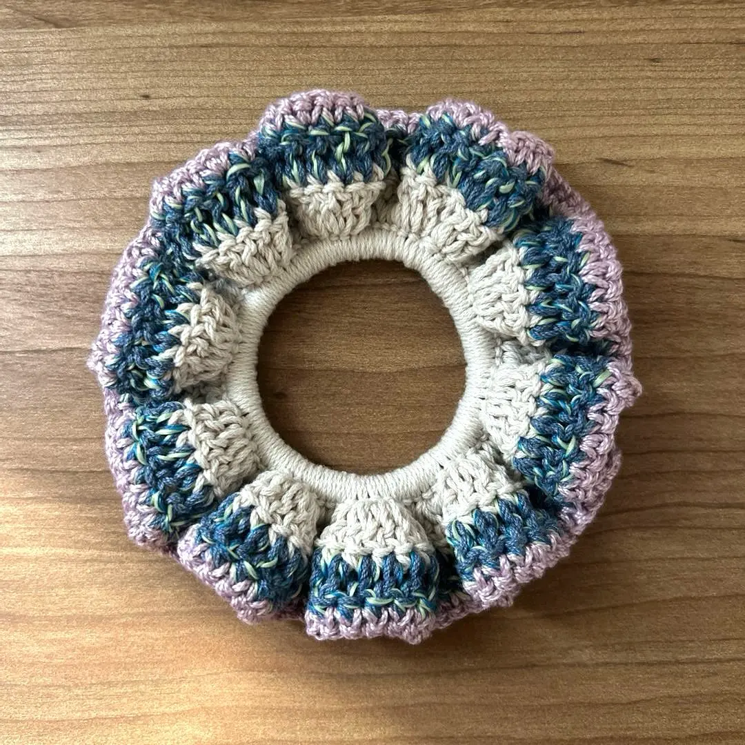 Thumbnail of Handmade, hand-knitted scrunchie hair accessory, crochet