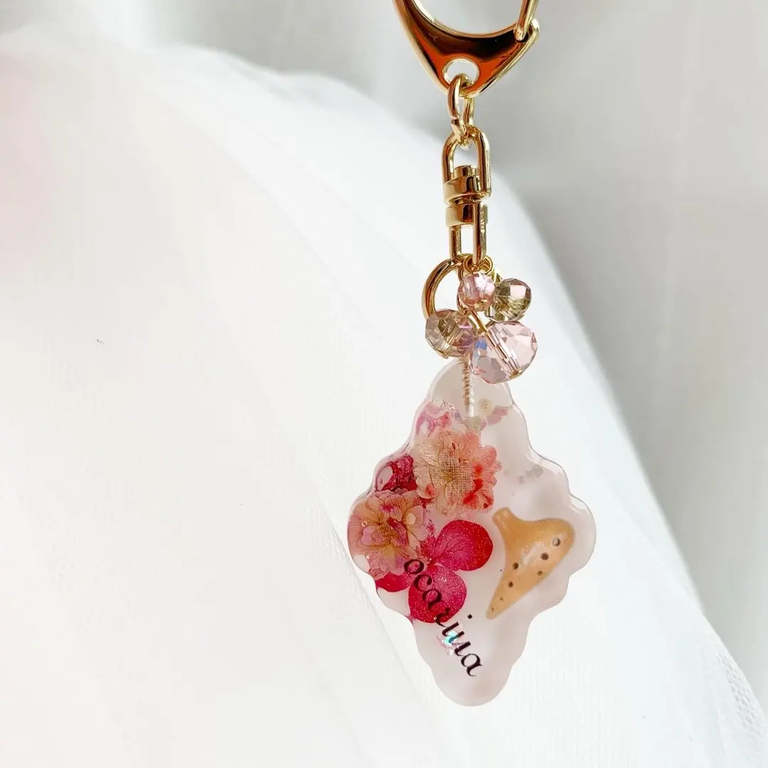 Thumbnail of Ocarina White Moroccan Tile Keychain with Warm-Colored Flowers