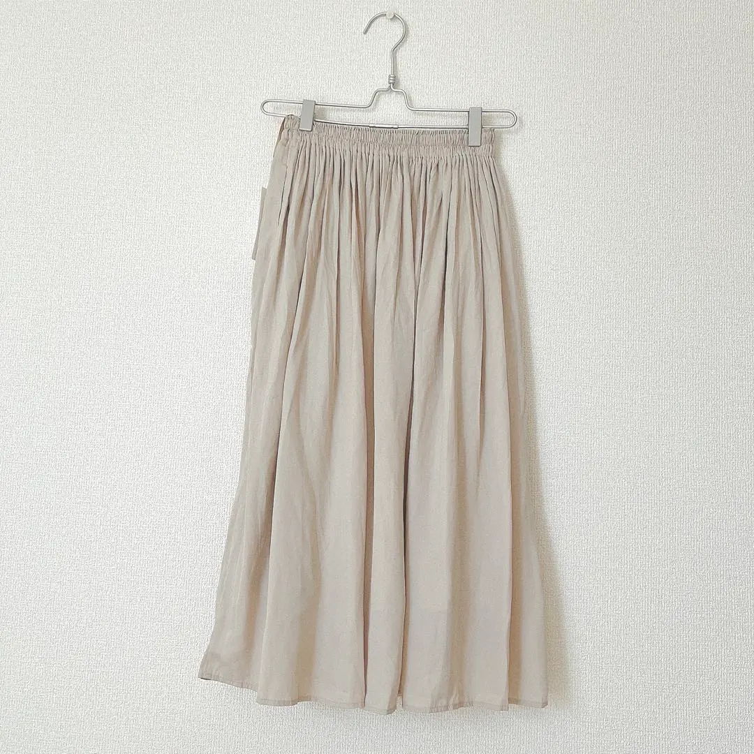 Thumbnail of New with tags Uniqlo skirt, beige, XS