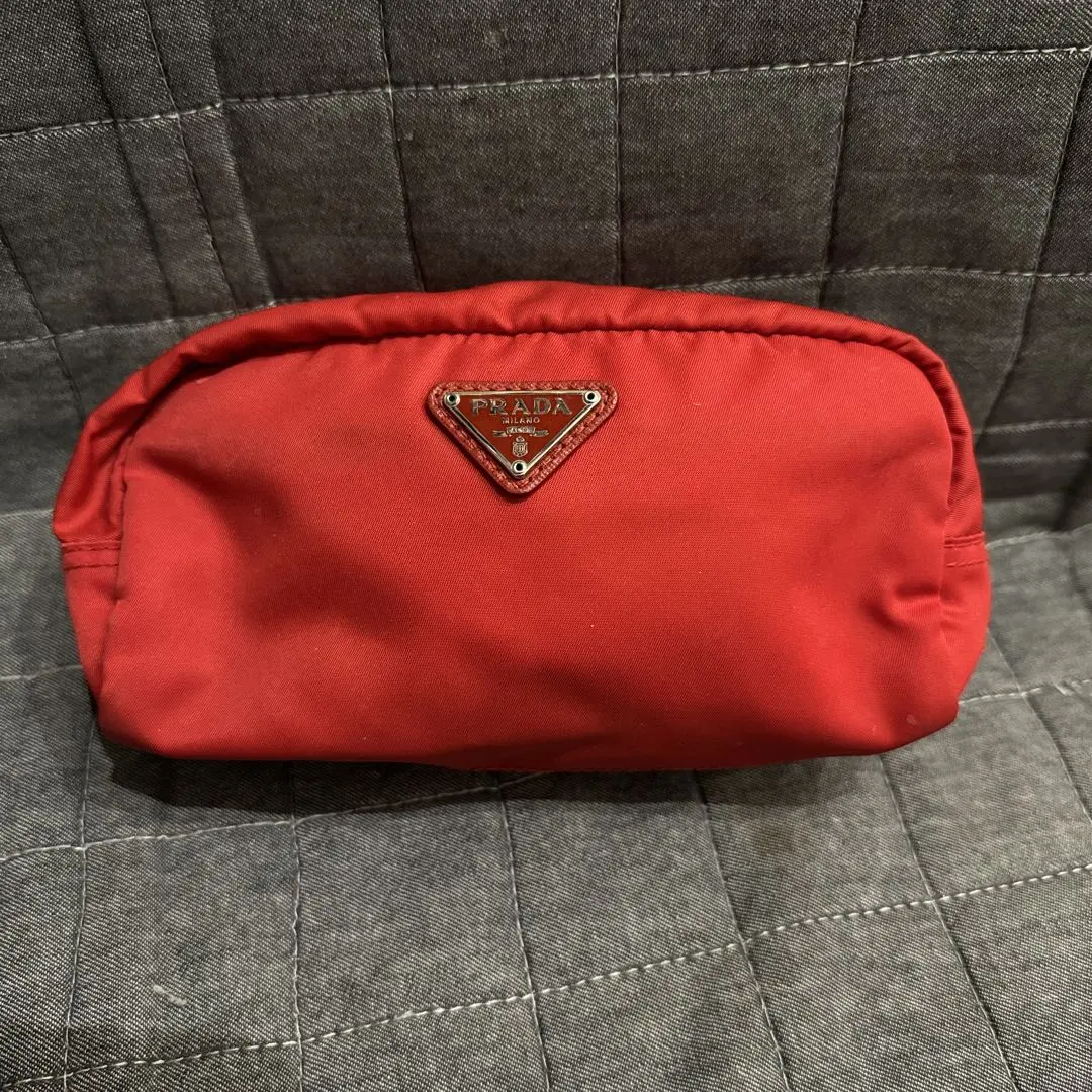 Thumbnail of PRADA pouch with logo and triangle plate