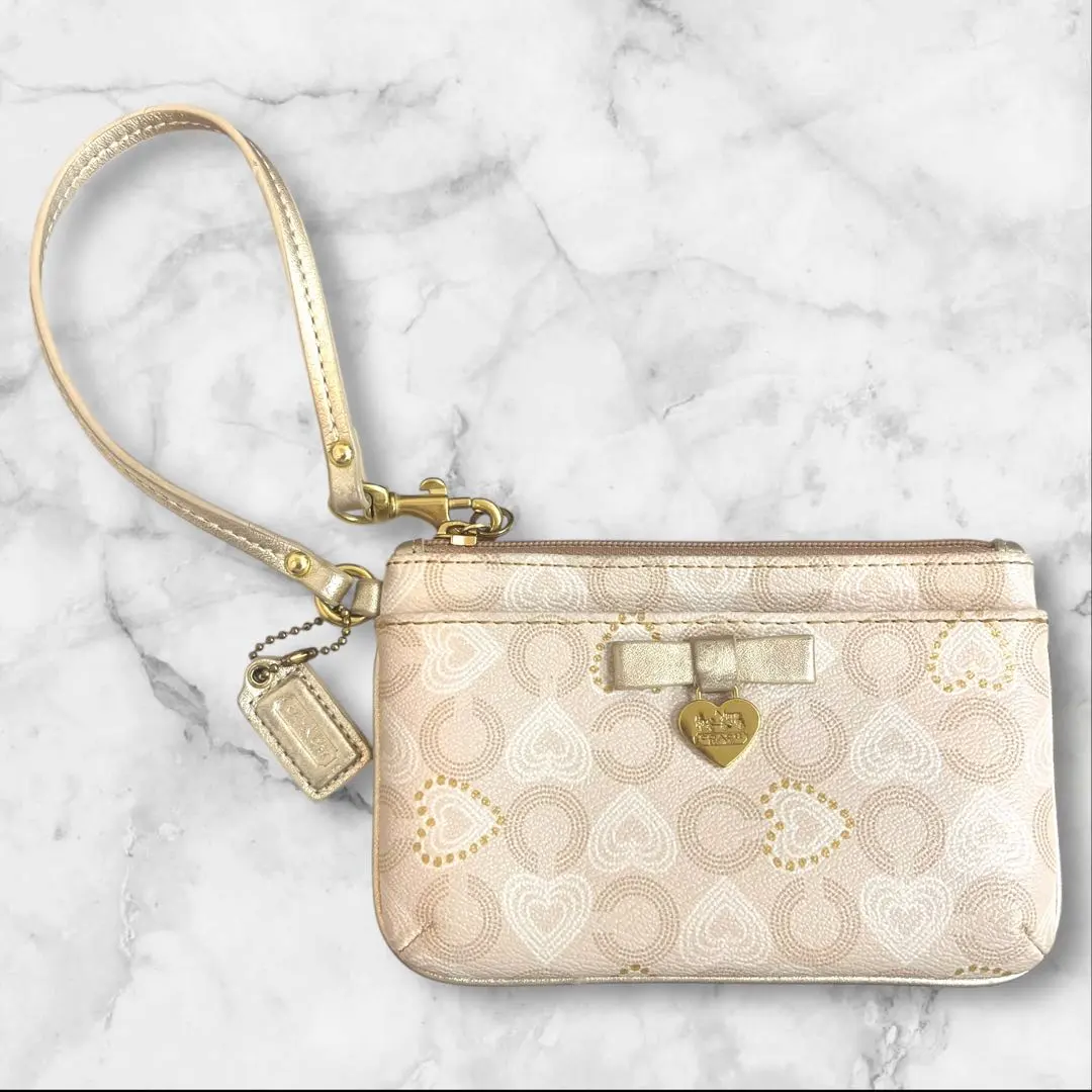 Thumbnail of ✨COACH Heart Pattern Wristlet Pouch Beige x Gold✨