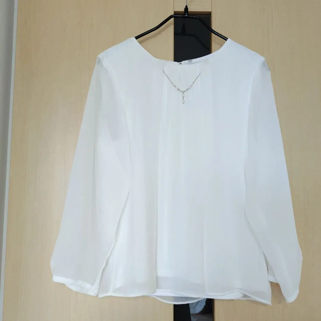 Thumbnail of White long-sleeved blouse