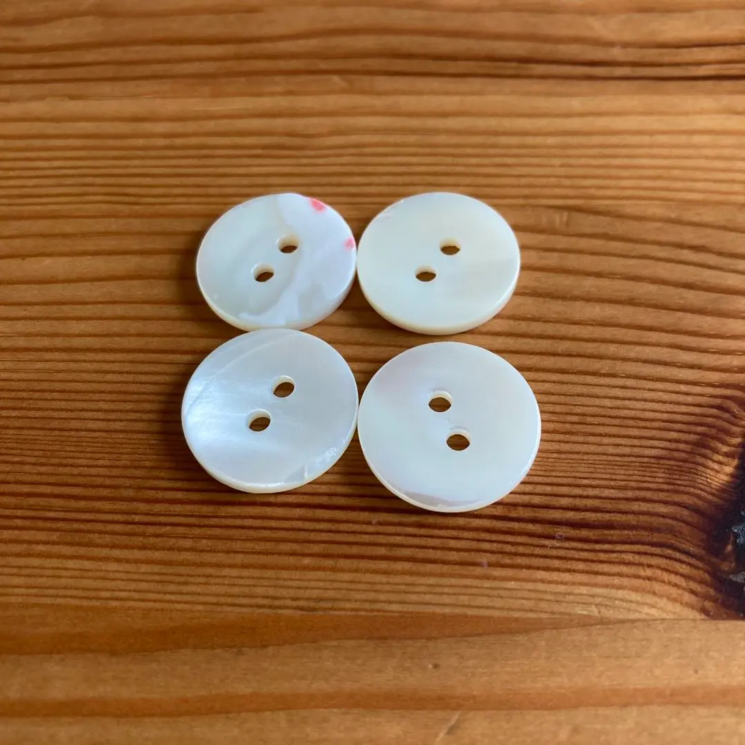 Thumbnail of White shell-like buttons, two holes, set of 4