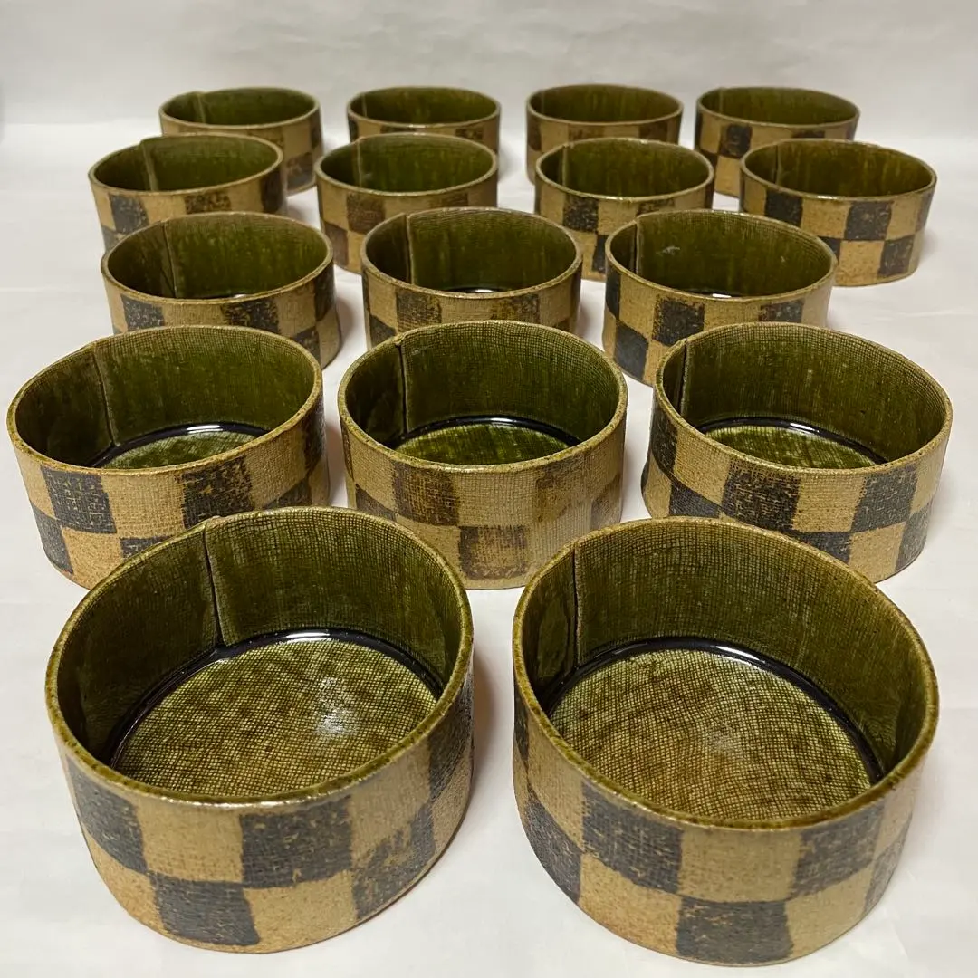 Thumbnail of Ceramic tableware set with checkered pattern, 16 pieces