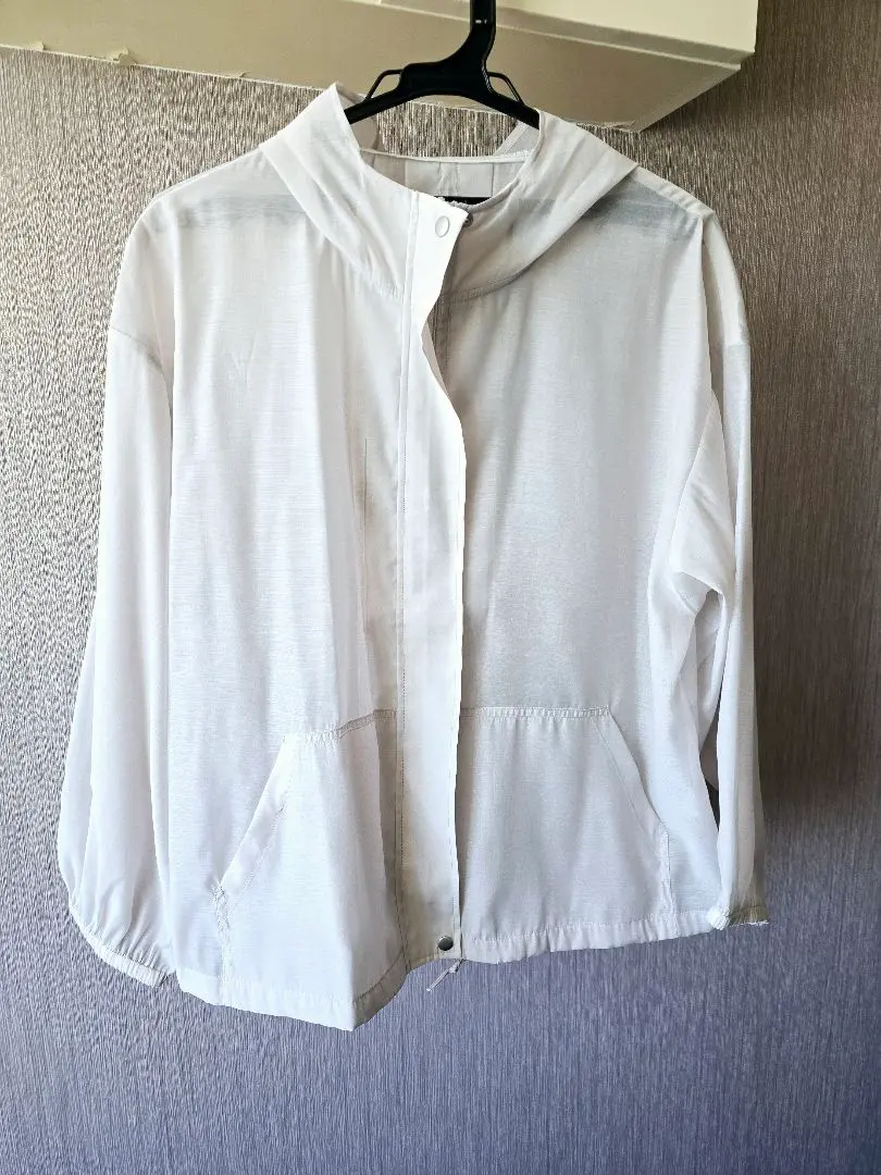 Thumbnail of Excellent condition white-gray hooded lightweight jacket