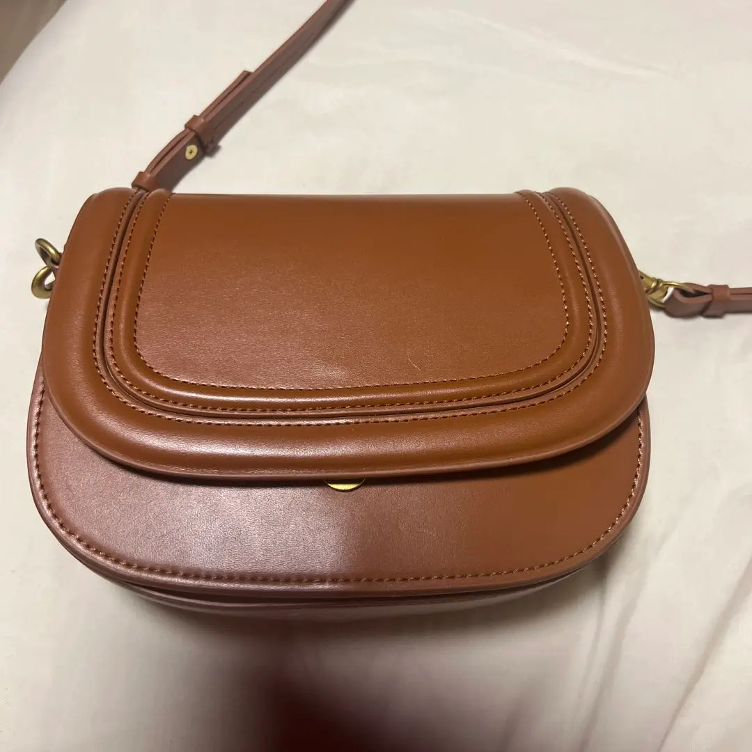 Thumbnail of Brown flap shoulder bag