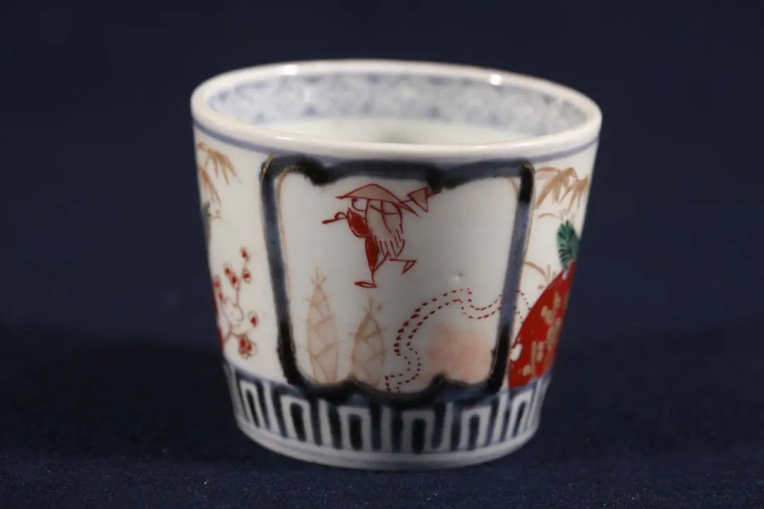 Thumbnail of 386 Ko-Imari, color-painted, snow scene with bamboo shoots, window design, pine, bamboo, and plum pattern soba choko (small bowl for noodles). No defects, excellent condition. Mid-Edo period.