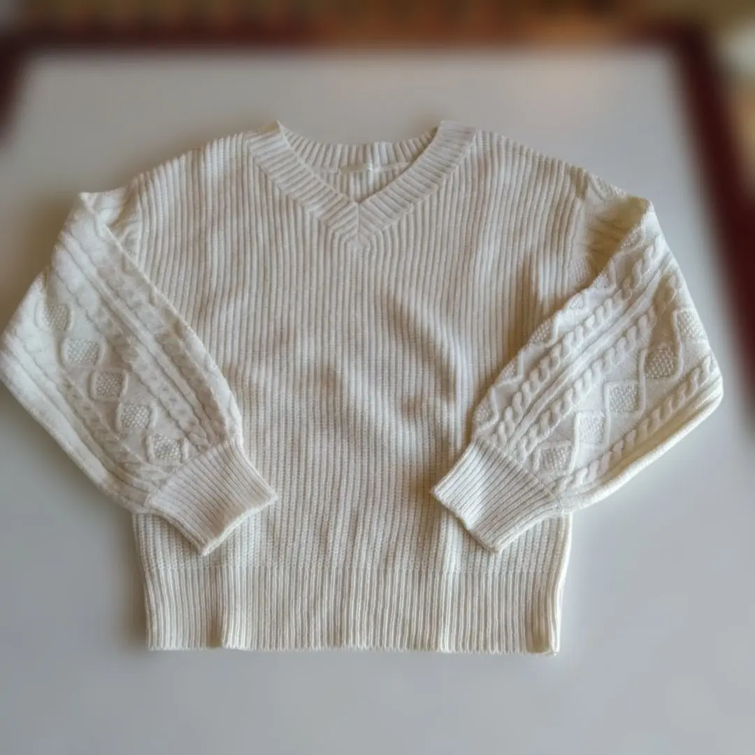 Thumbnail of White V-neck knit sweater