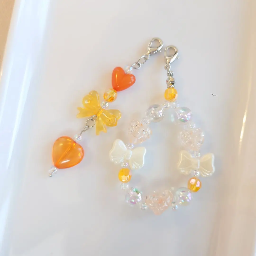 Thumbnail of 【No. 108】Tamagotchi Bead Charm Strap, Orange-toned, Heart Ribbon
