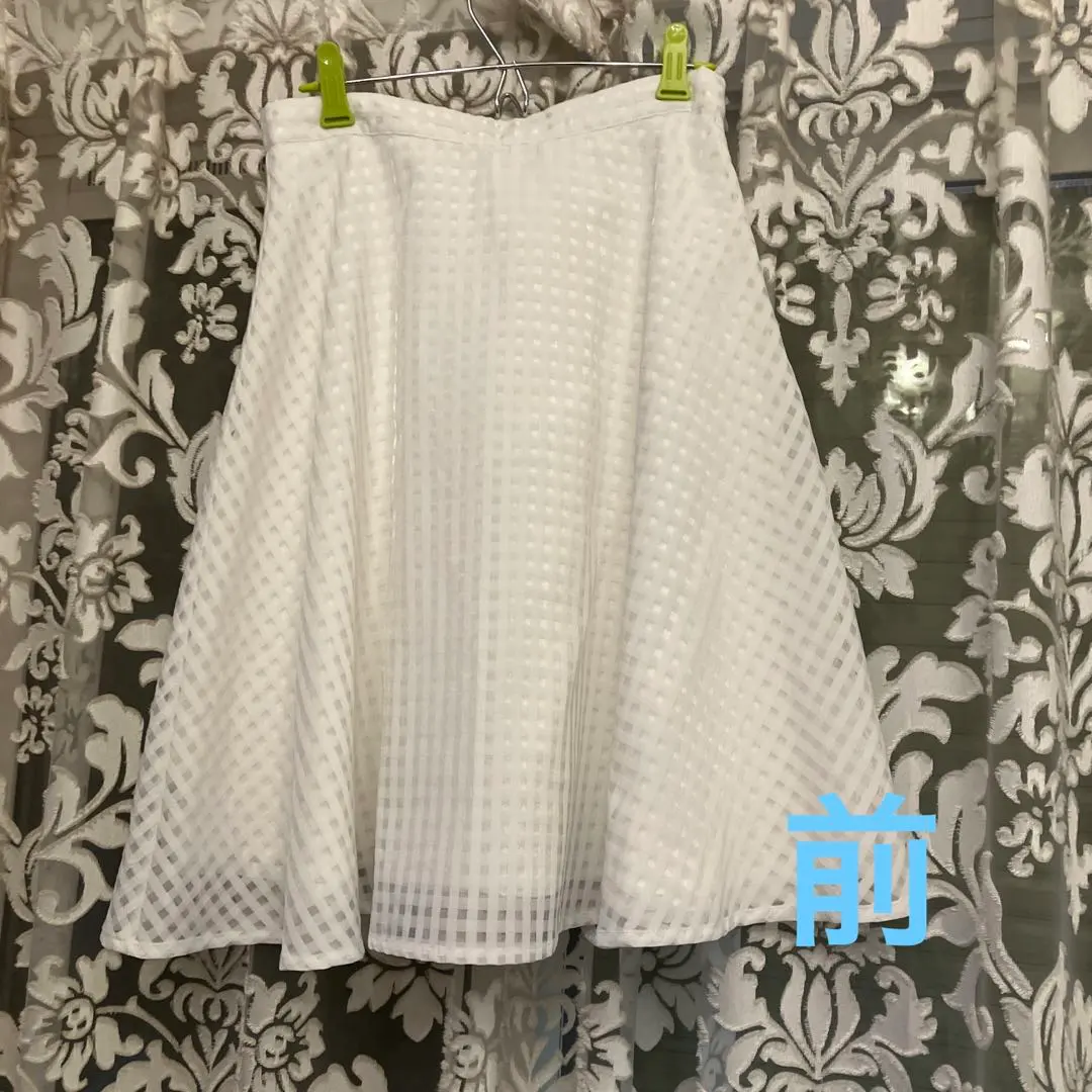 Thumbnail of A minimalist white skirt