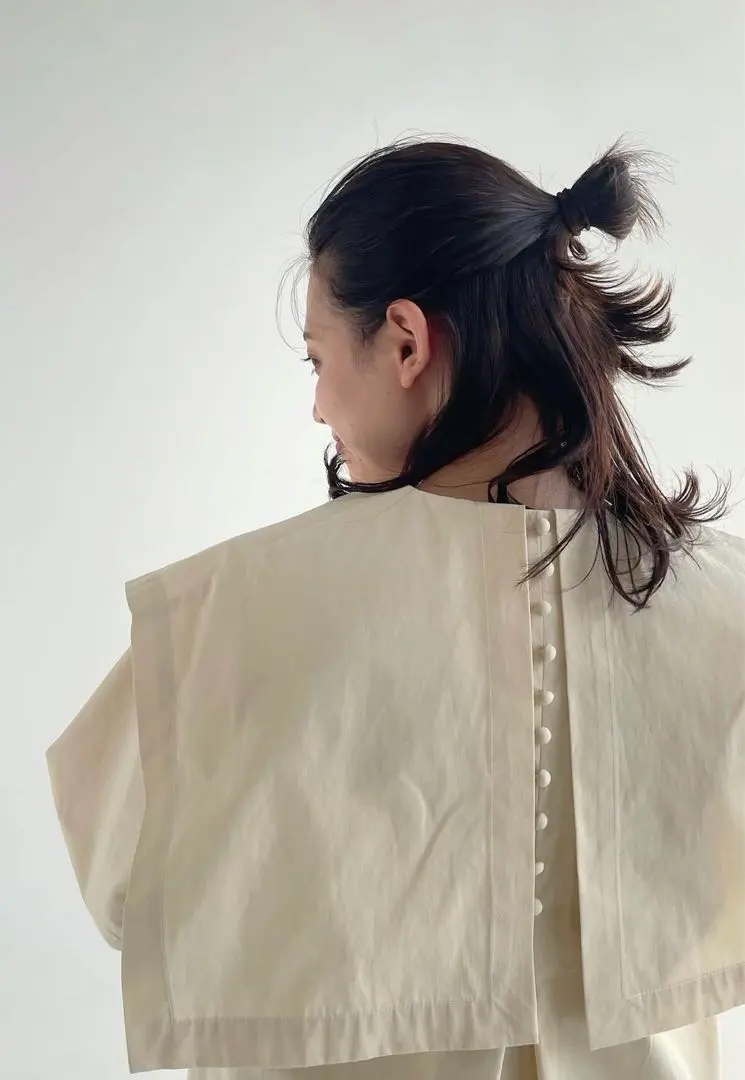 Thumbnail of Cream-colored top with a collar