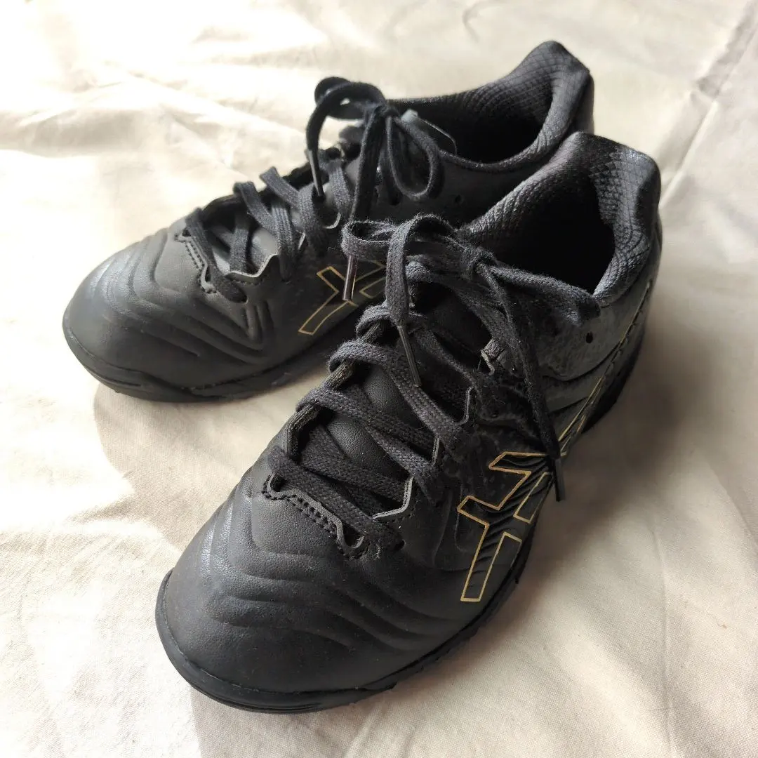 Thumbnail of ASICS black soccer shoes