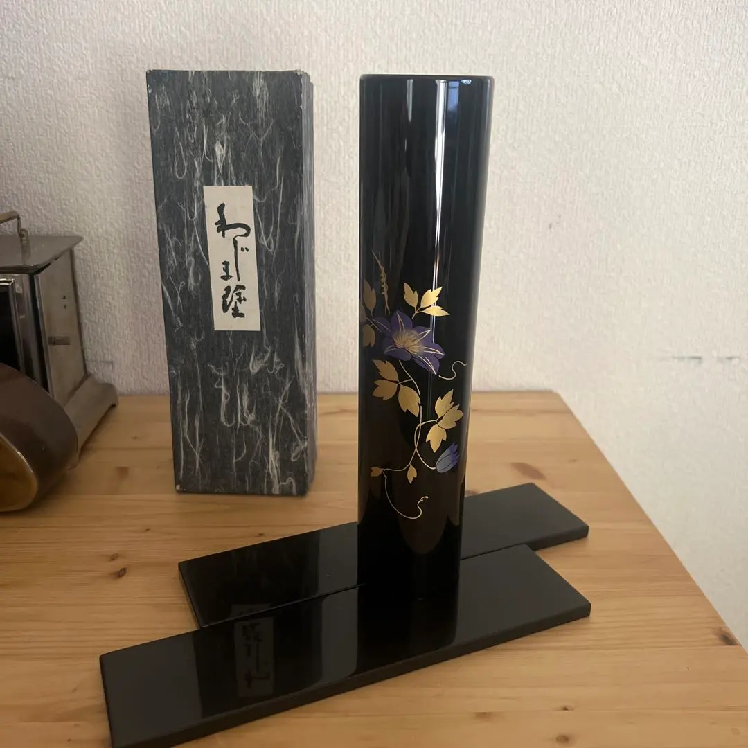 Thumbnail of Lacquerware cylindrical vase with gold and purple patterns, with outer box