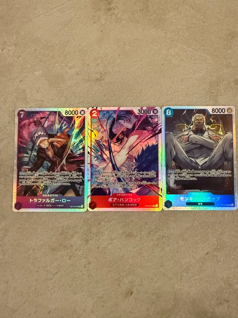 Thumbnail of One Piece Card Game - Bonds of Master and Disciple SR 3-Card Set: Hancock, Law, Garp