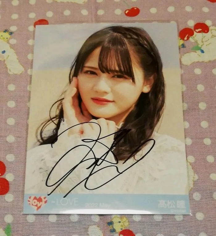Thumbnail of =LOVE Hitomi Takamatsu official photo with a handwritten signature, close-up shot