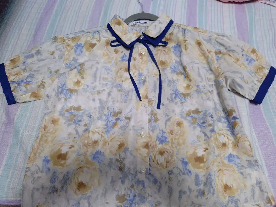 Thumbnail of Short-sleeved blouse with floral ribbon, size 38