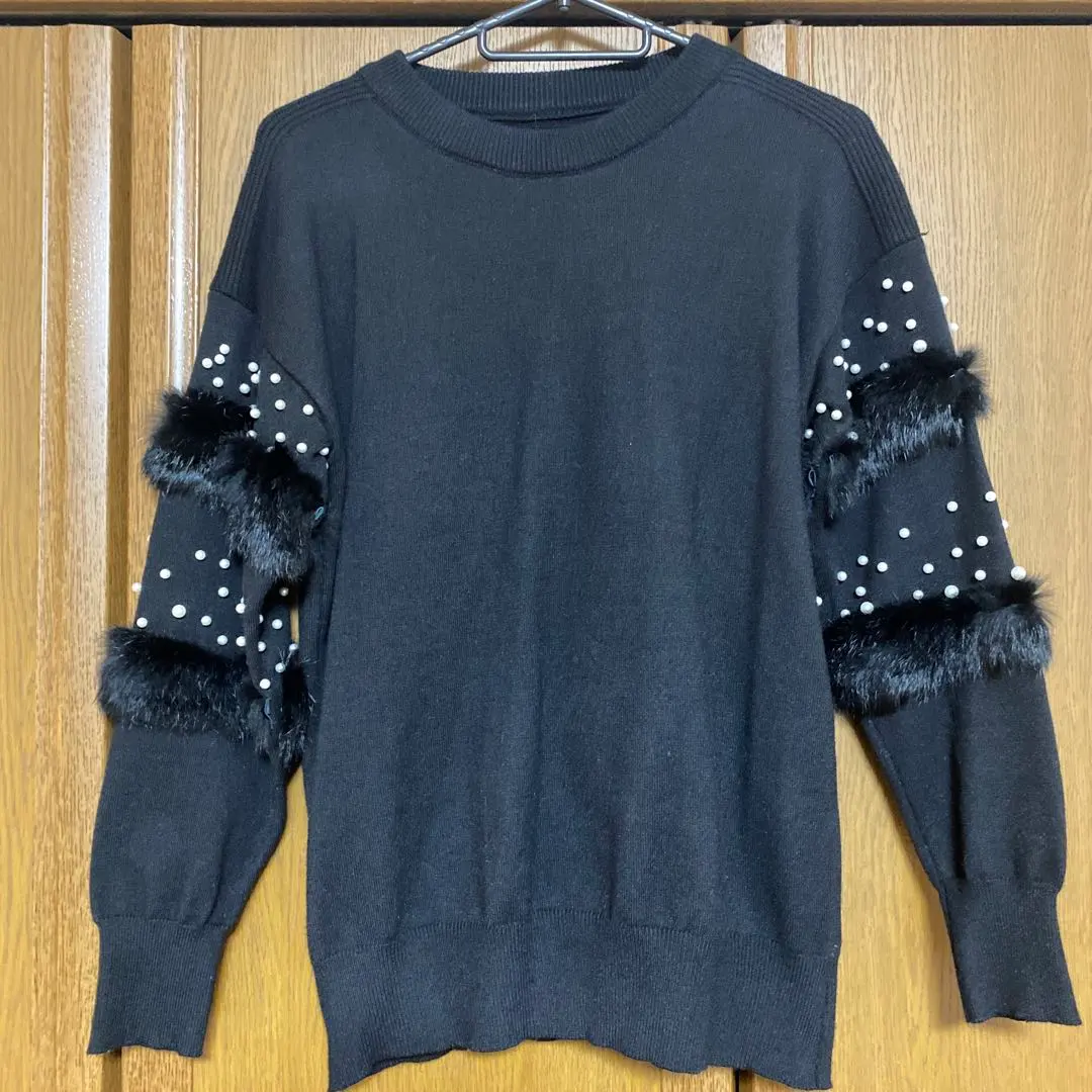 Thumbnail of Black knit sweater with pearls and fur, top