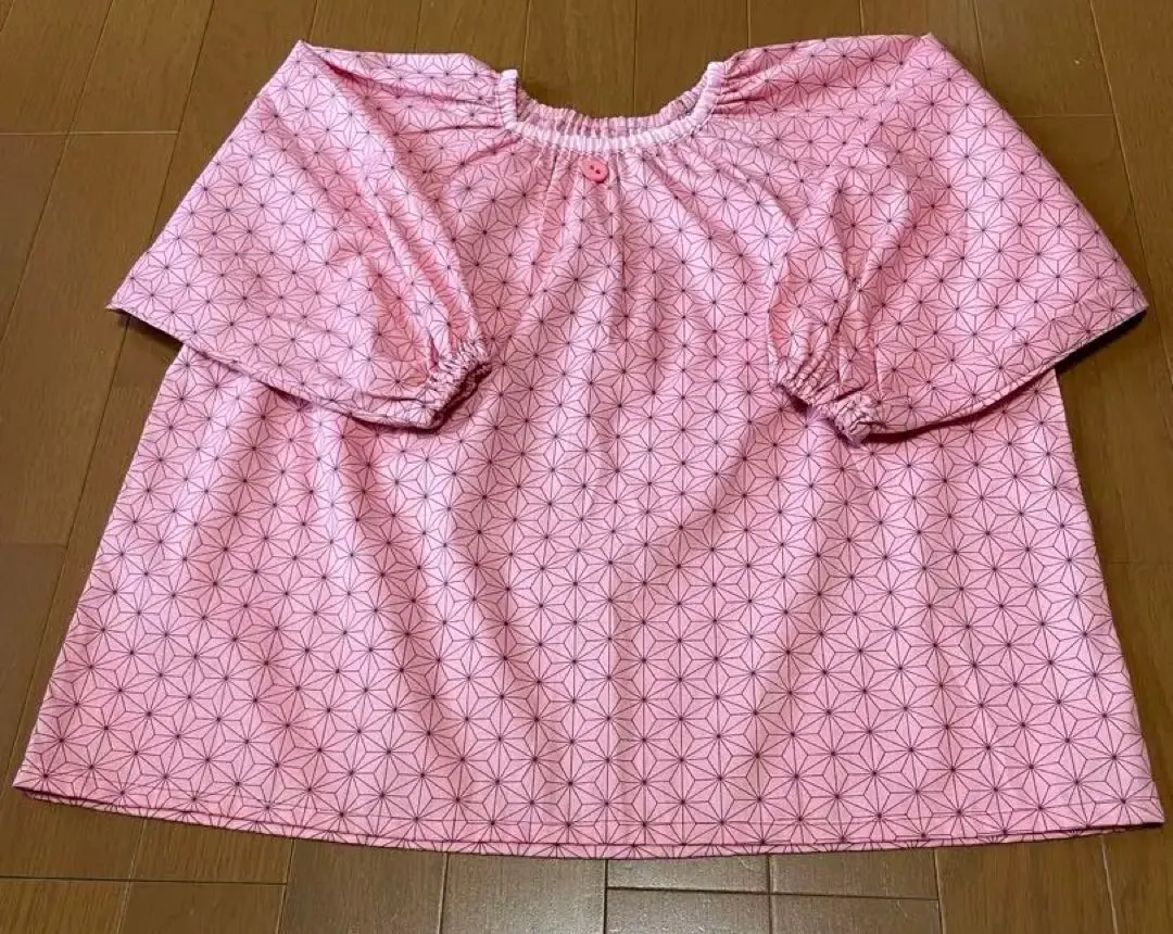 Thumbnail of Pink kindergarten smock, geometric pattern