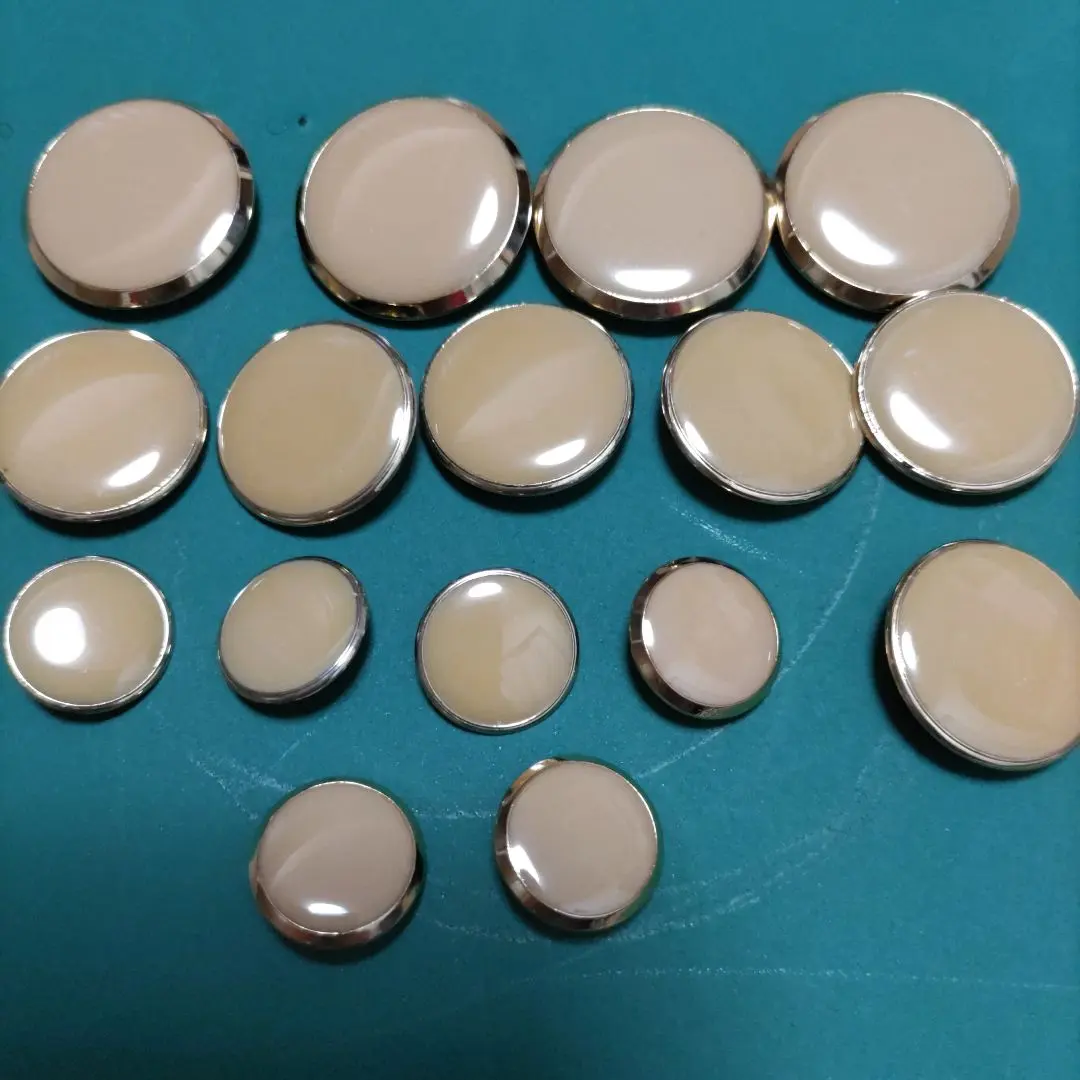 Thumbnail of Beige round metal button set (4 large, 6 medium, 6 small)
