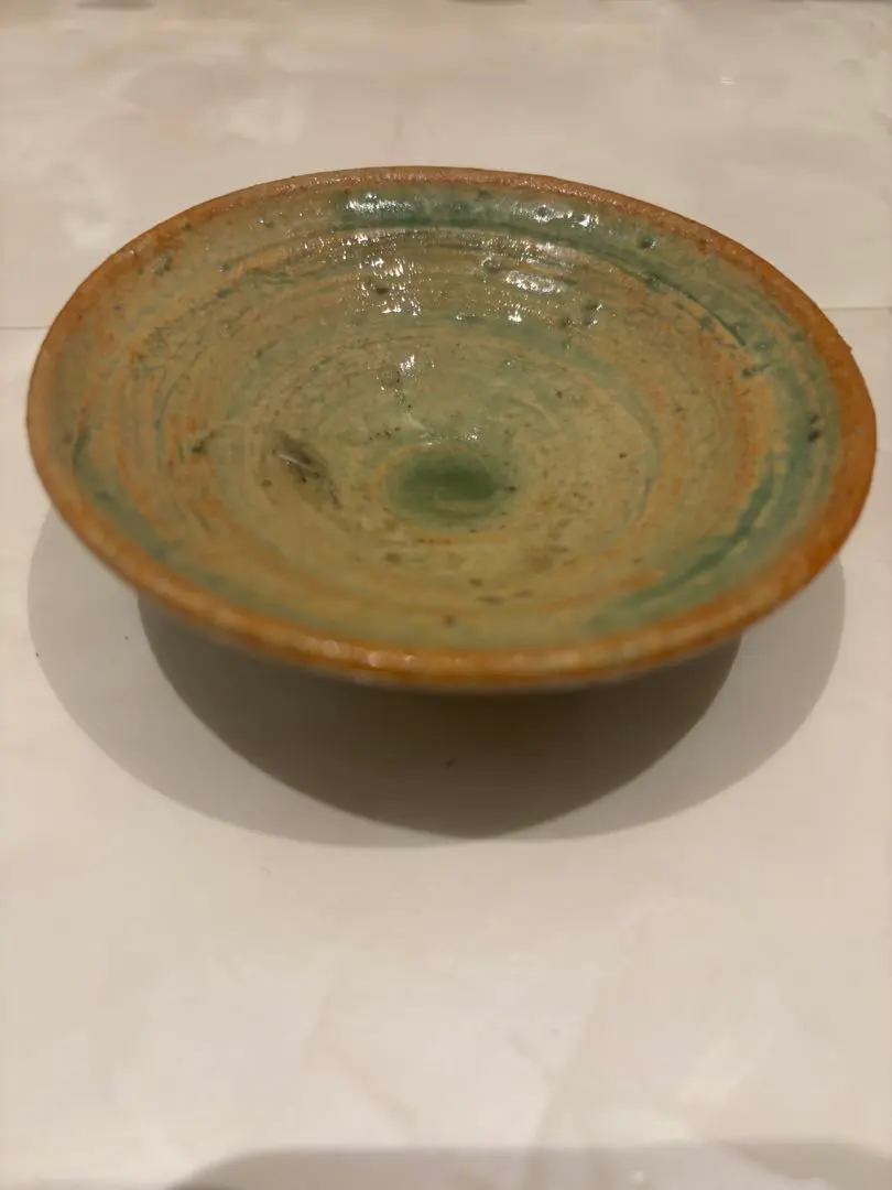 Thumbnail of A shallow ceramic dish, green and brown.