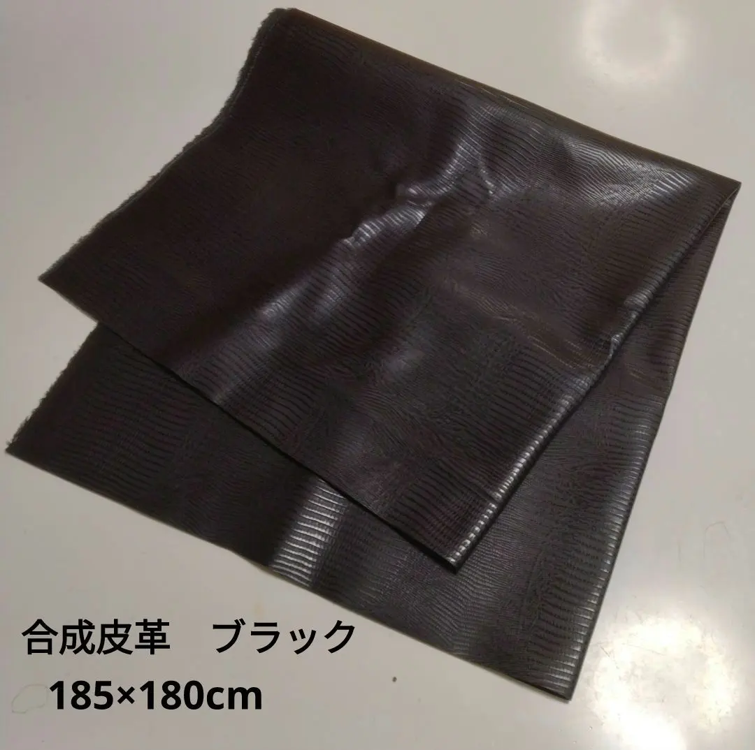 Thumbnail of Synthetic leather, black, with embossed vertical stripes for a scale pattern.