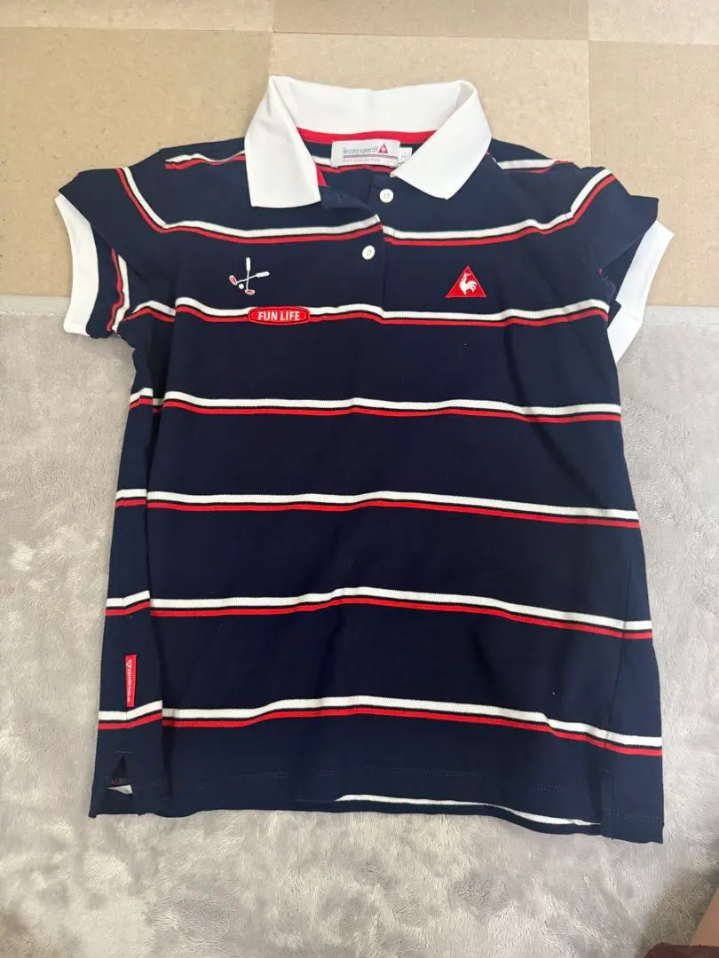 Thumbnail of Le Coq Sportif navy and white striped polo shirt