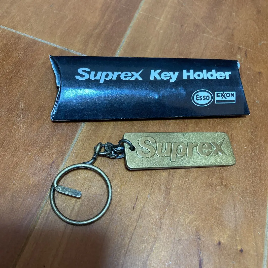 Thumbnail of New, Unused ESSO Suprex Keychain, Gold, Shiny, 30g
