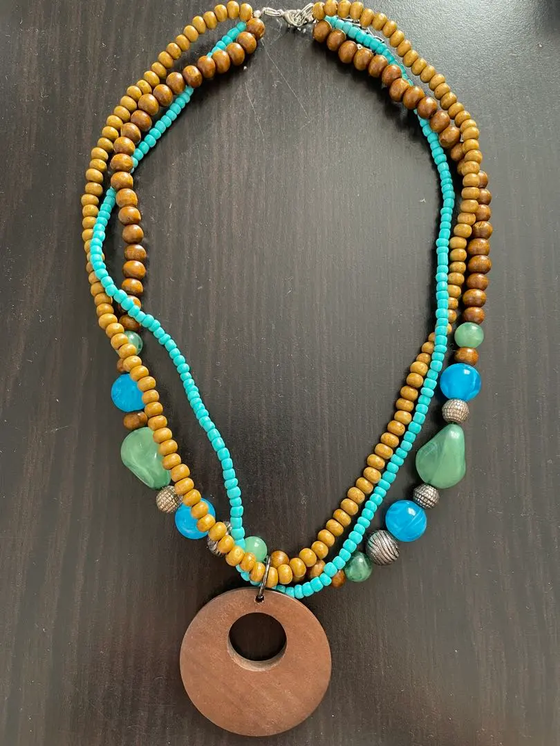 Thumbnail of Multi-layer necklace with wooden beads and circular pendant