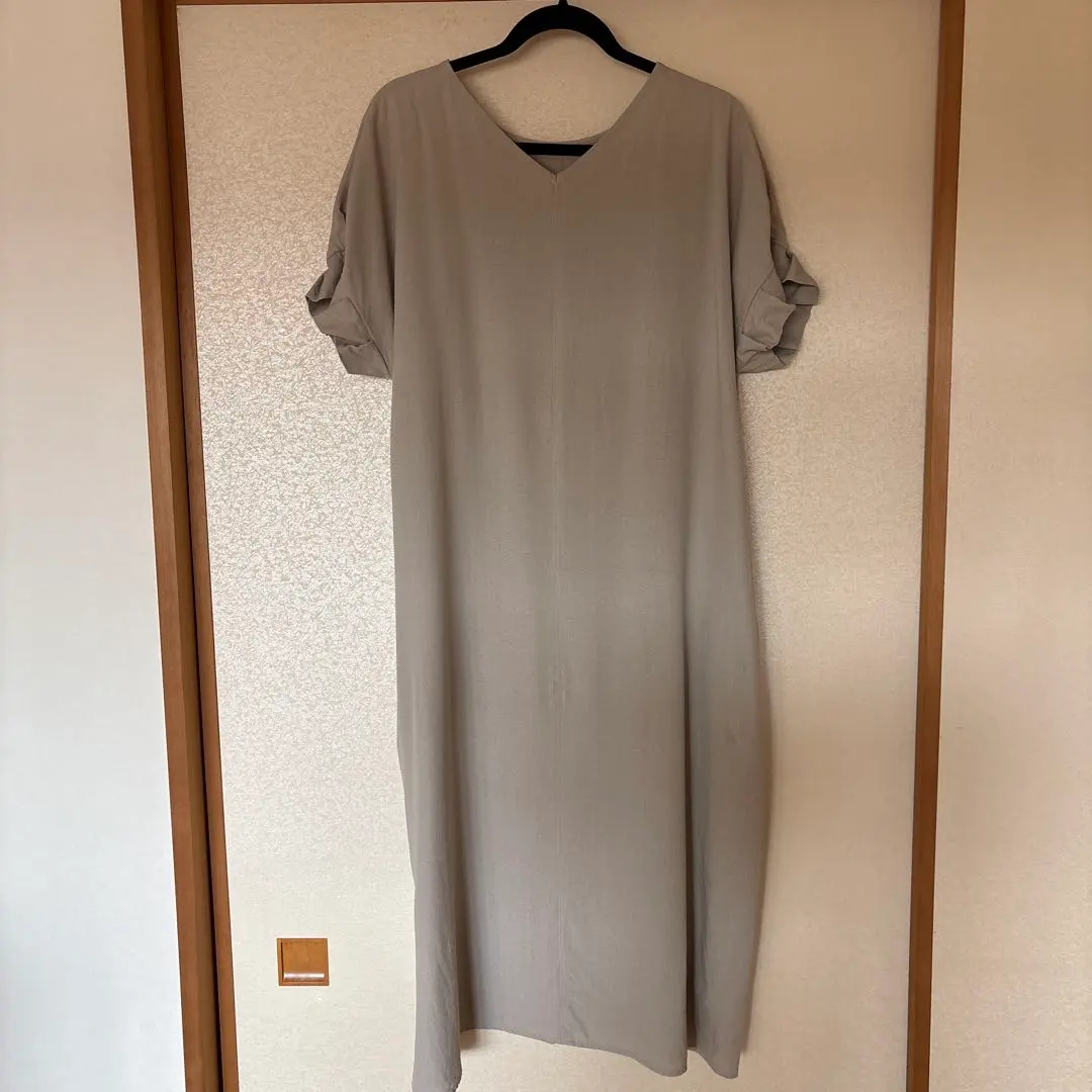 Thumbnail of Beige V-neck long cut-and-sew dress