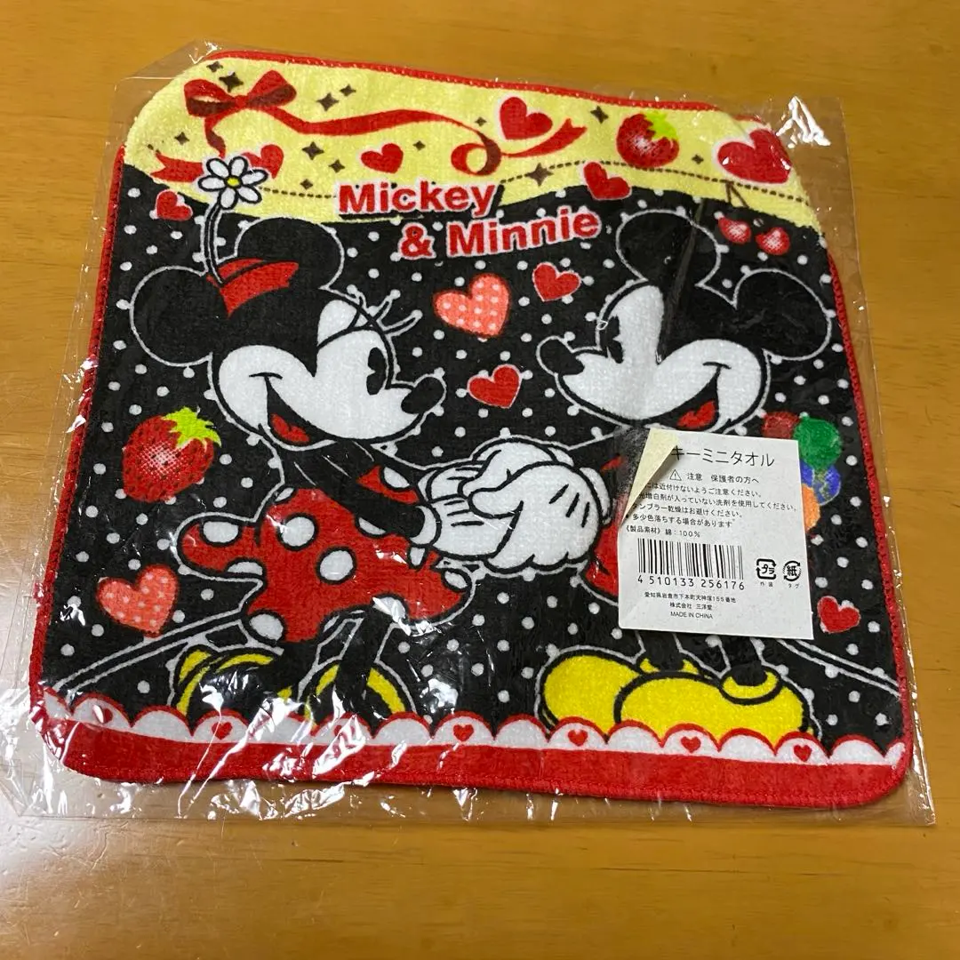 Thumbnail of Unopened Mickey Mouse and Minnie Mouse mini towels, black with polka dots