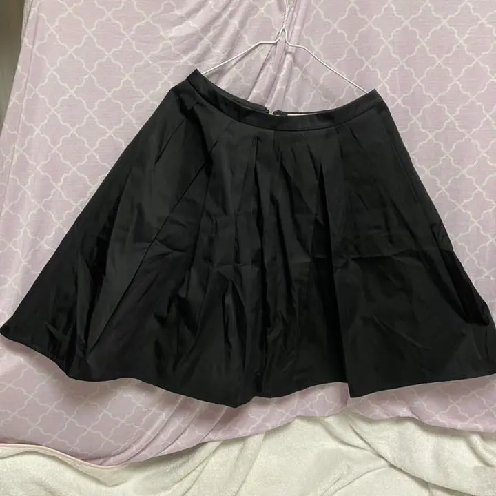 Thumbnail of New with tags, black, also suitable for formal occasions, a flared skirt with a vivid pink lining.