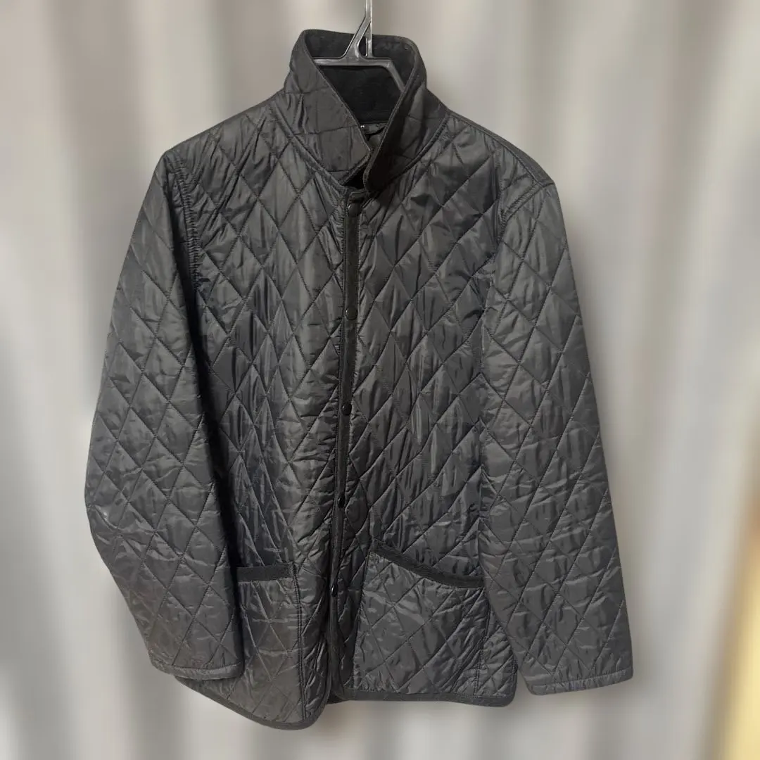 Thumbnail of Black quilted jacket, size M