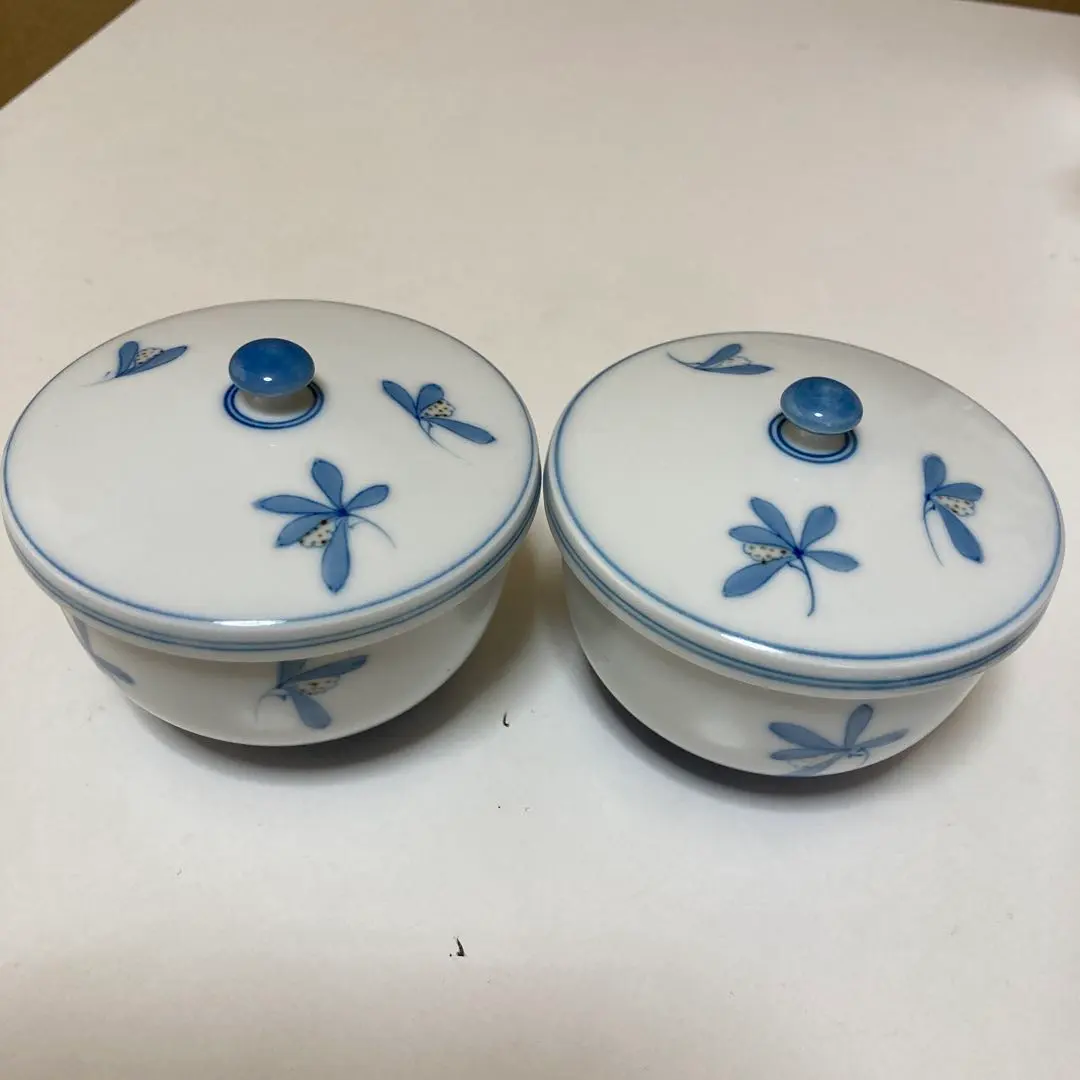 Thumbnail of Two sets of teacups with lids