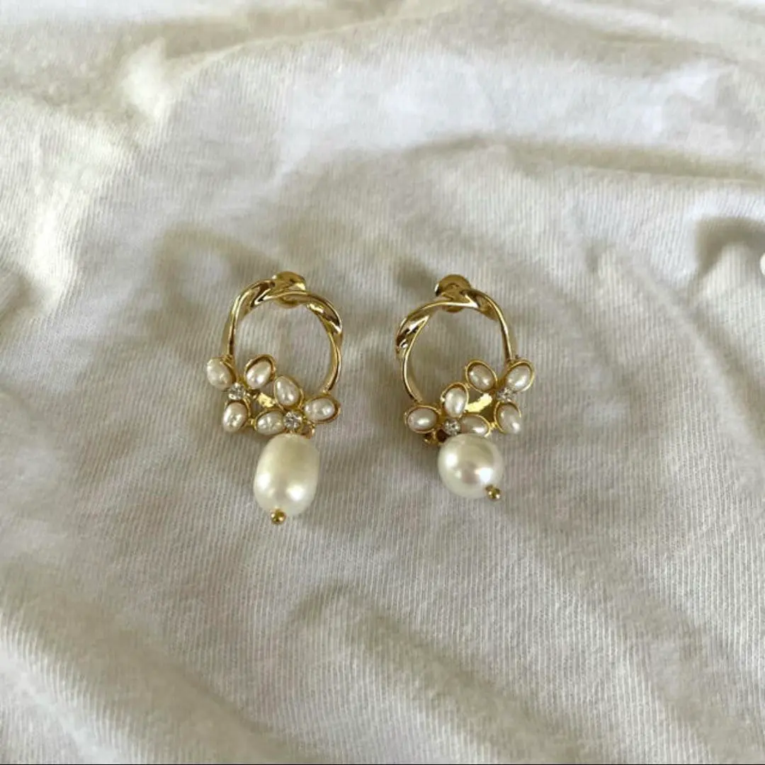 Thumbnail of Gold pearl motif earrings, new and unused