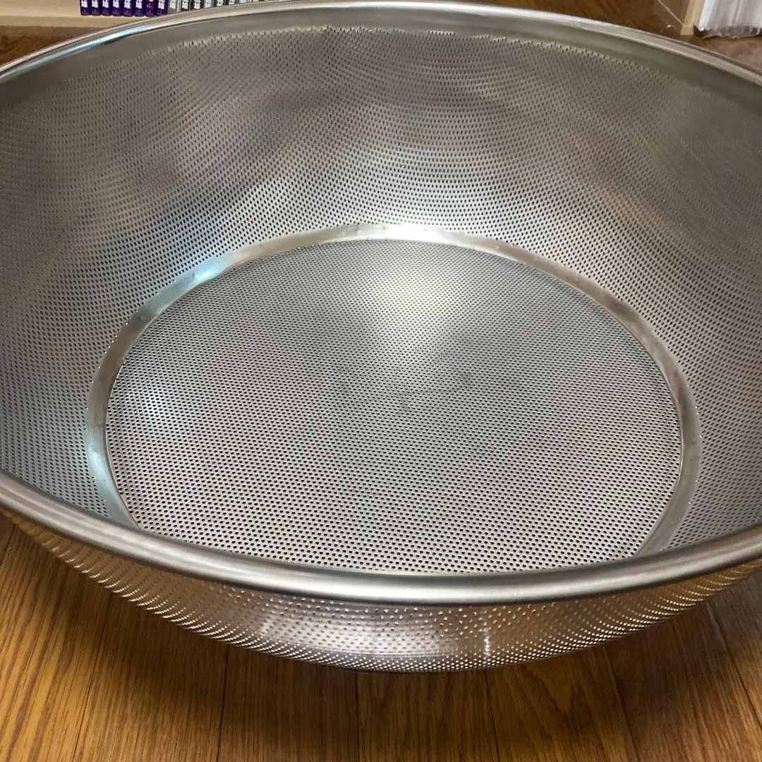 Thumbnail of Commercial-grade stainless steel perforated colander, 60cm diameter, 22cm height