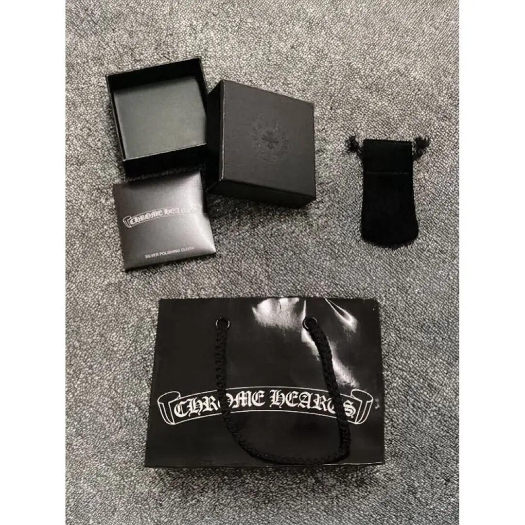 Thumbnail of Chrome Hearts 4-piece accessory set: gift box, polish cloth, leather pouch, paper bag, and box
