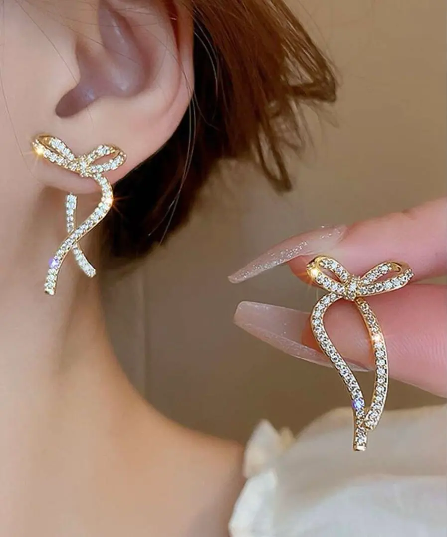 Thumbnail of Ribbon motif gold earrings, ribbon, Korea, sparkling
