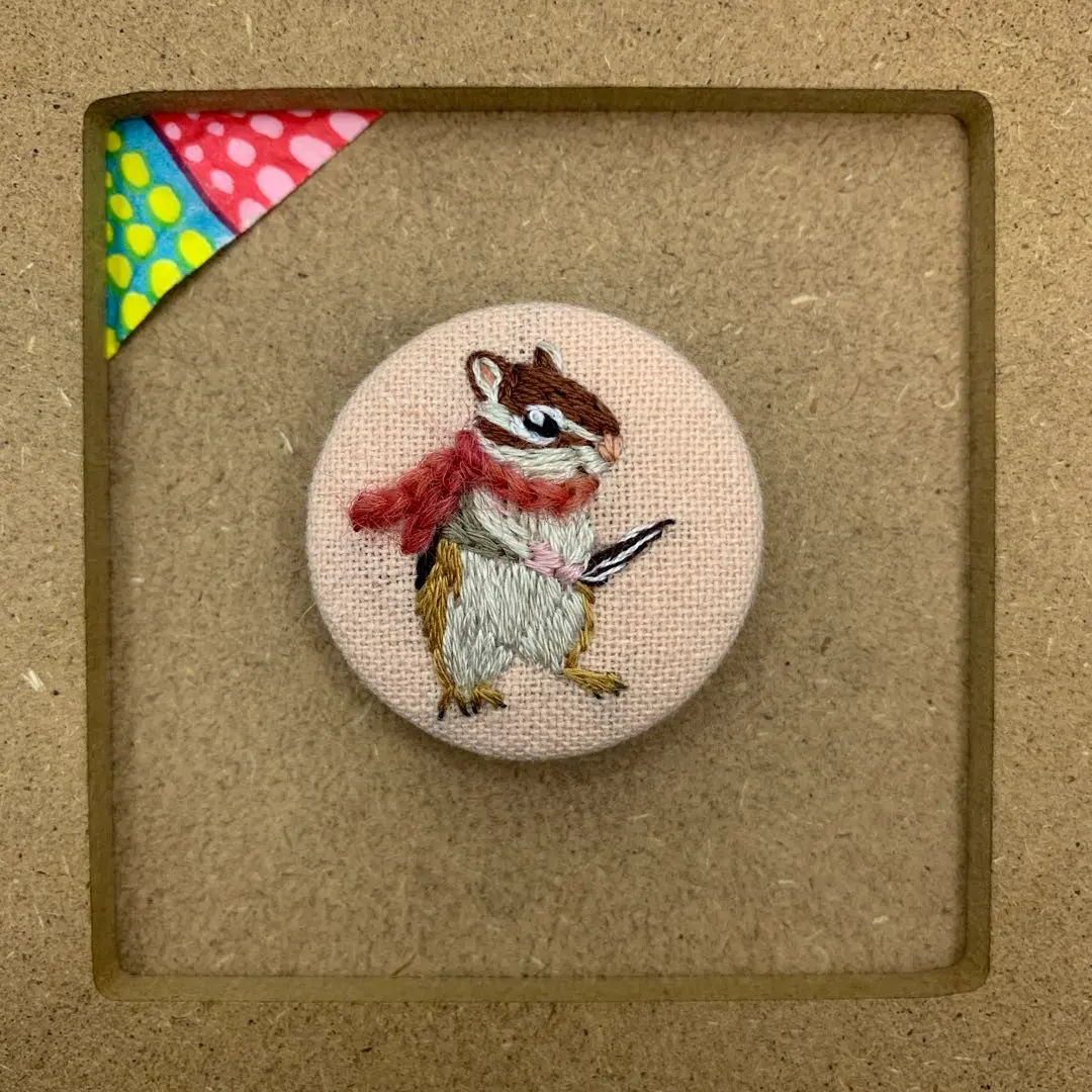 Thumbnail of Embroidered walnut button: Chipmunk wearing a scarf