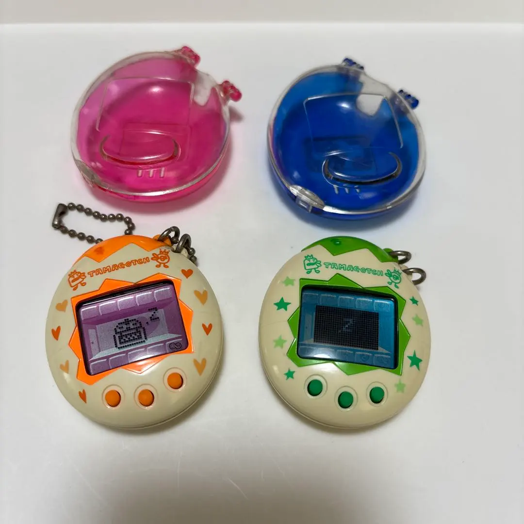 Thumbnail of Working Condition Confirmed - Heisei Retro - Osu-tchi & Mesu-tchi (Tamagotchi) - With Case - 1997