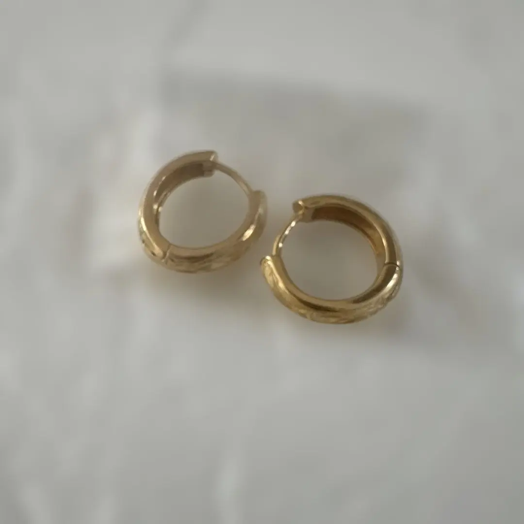 Thumbnail of Small gold hoop earrings