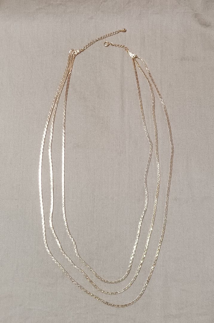 Thumbnail of Gold triple chain necklace
