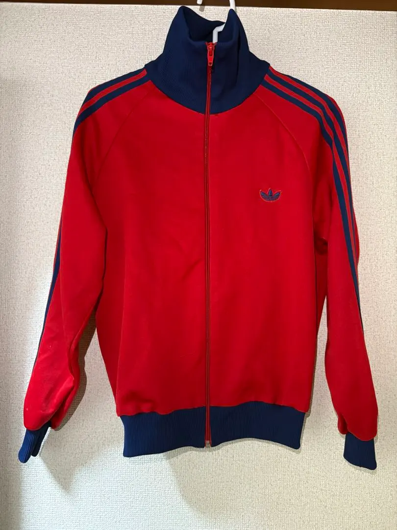 Thumbnail of Adidas red and blue track suit