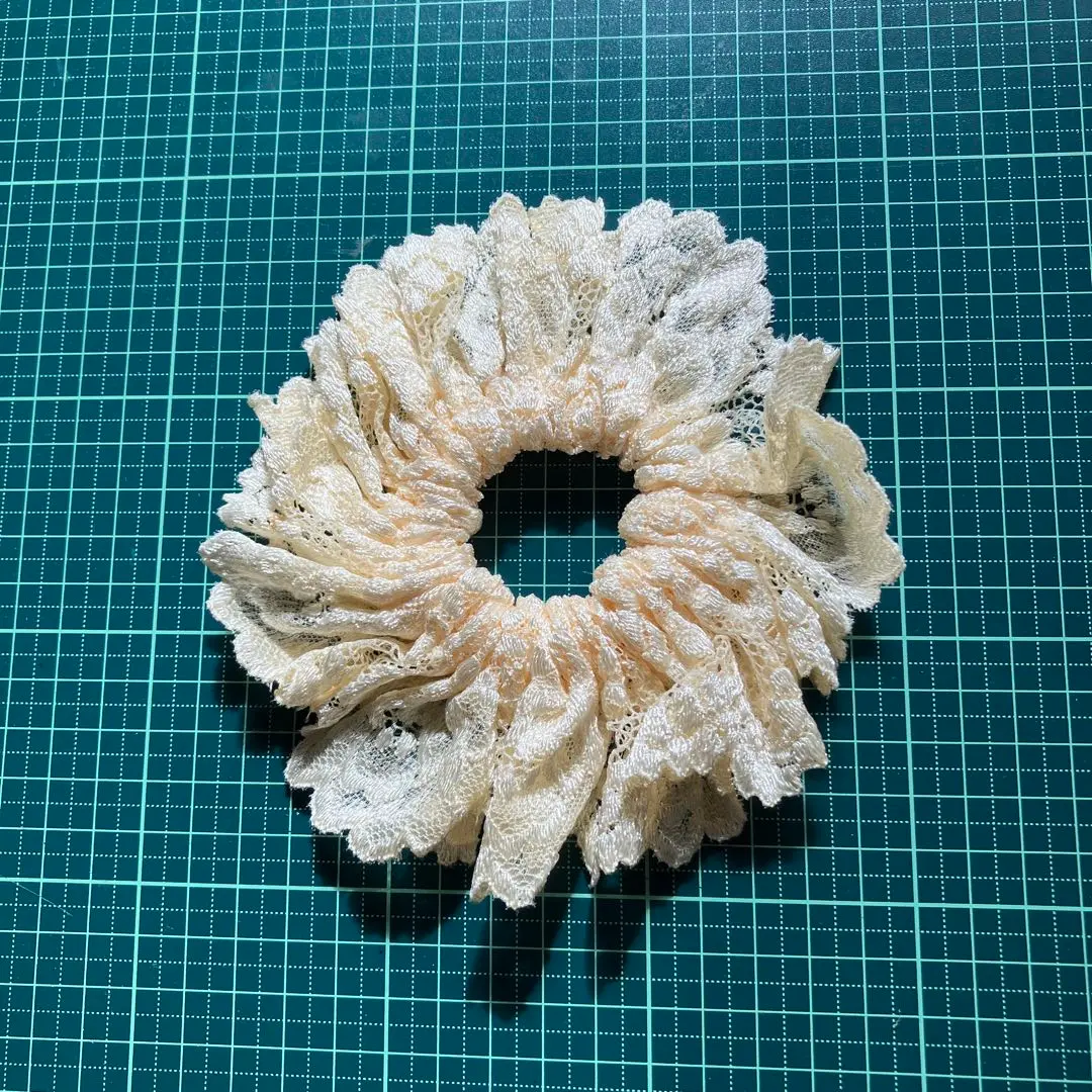 Thumbnail of Cream-colored lace scrunchie