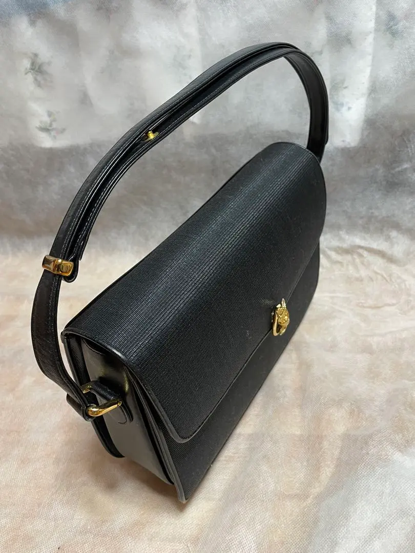 黑色禮服包 金色配件 的縮圖