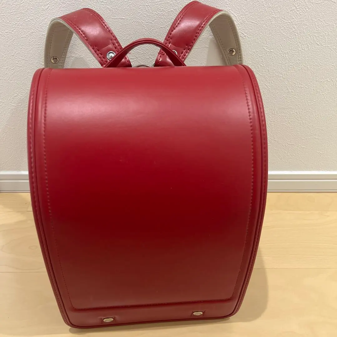 Thumbnail of A familiar red synthetic leather school backpack