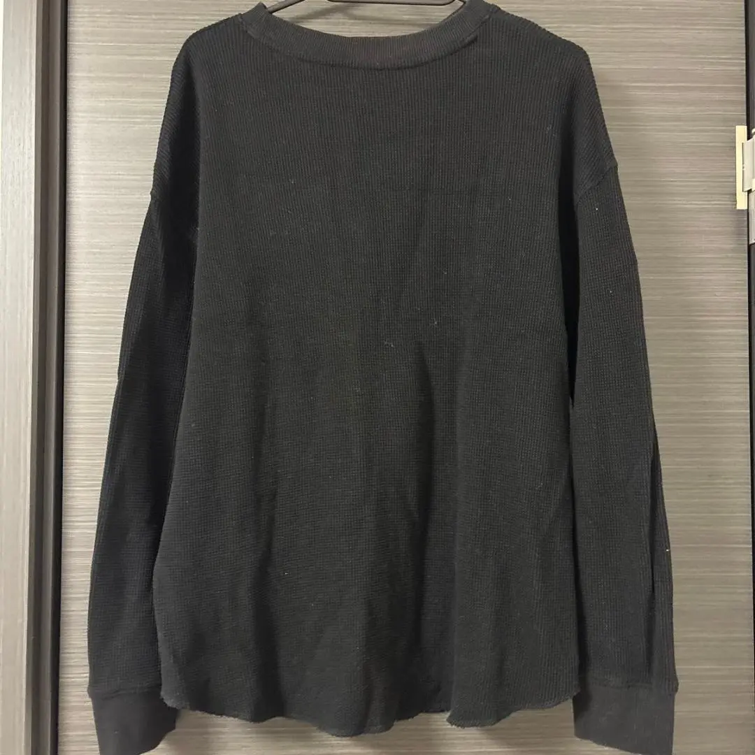 Thumbnail of Black ribbed long-sleeved knit top