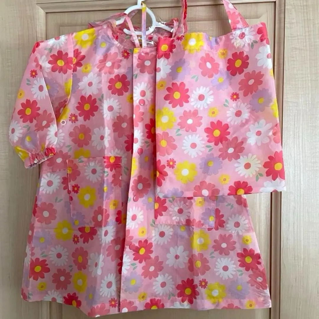 Thumbnail of Floral baby raincoat and tote bag