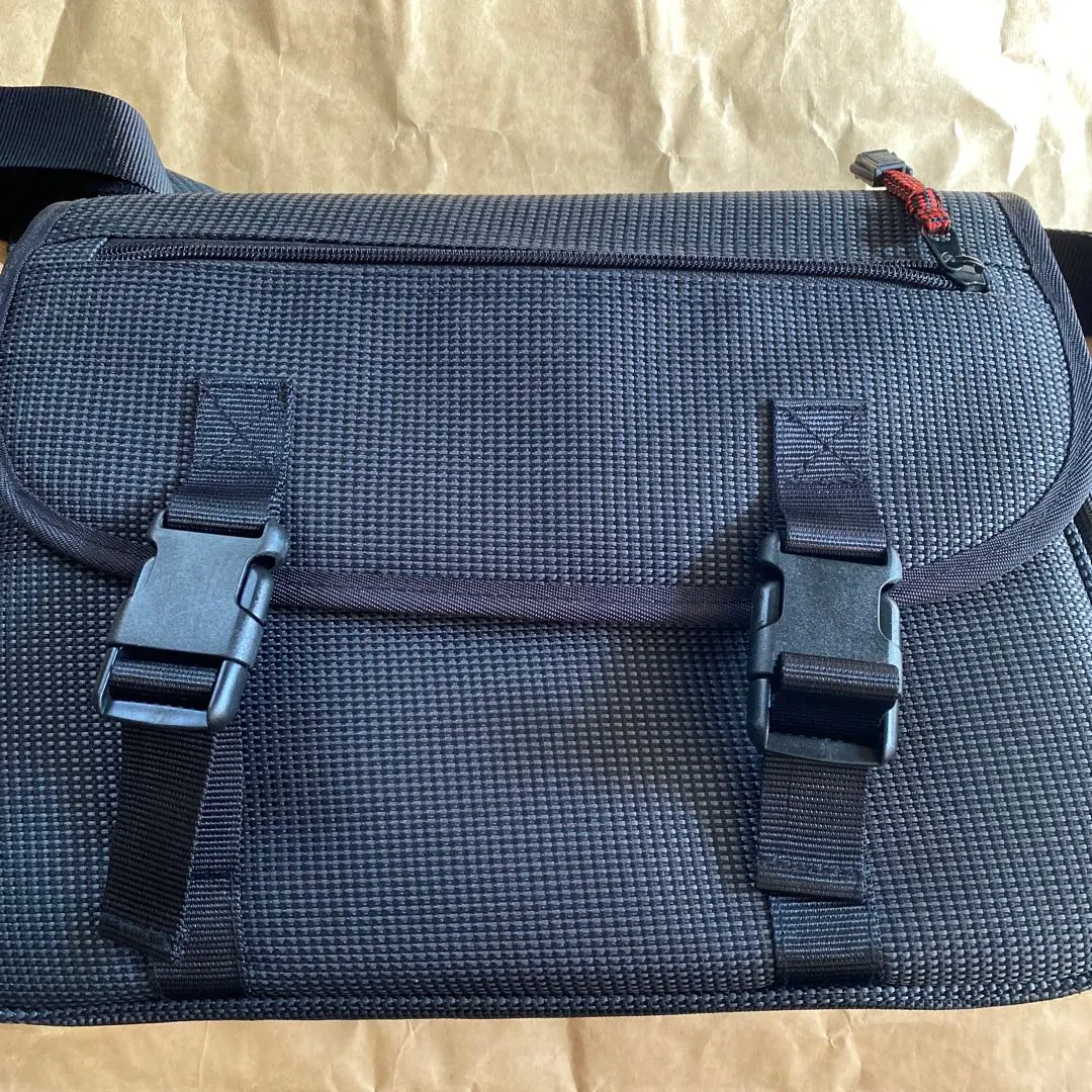 Thumbnail of Canon camera, black, bag (model number unknown)