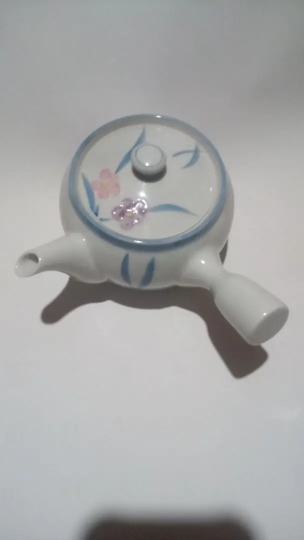Thumbnail of Medium white porcelain teapot with floral pattern