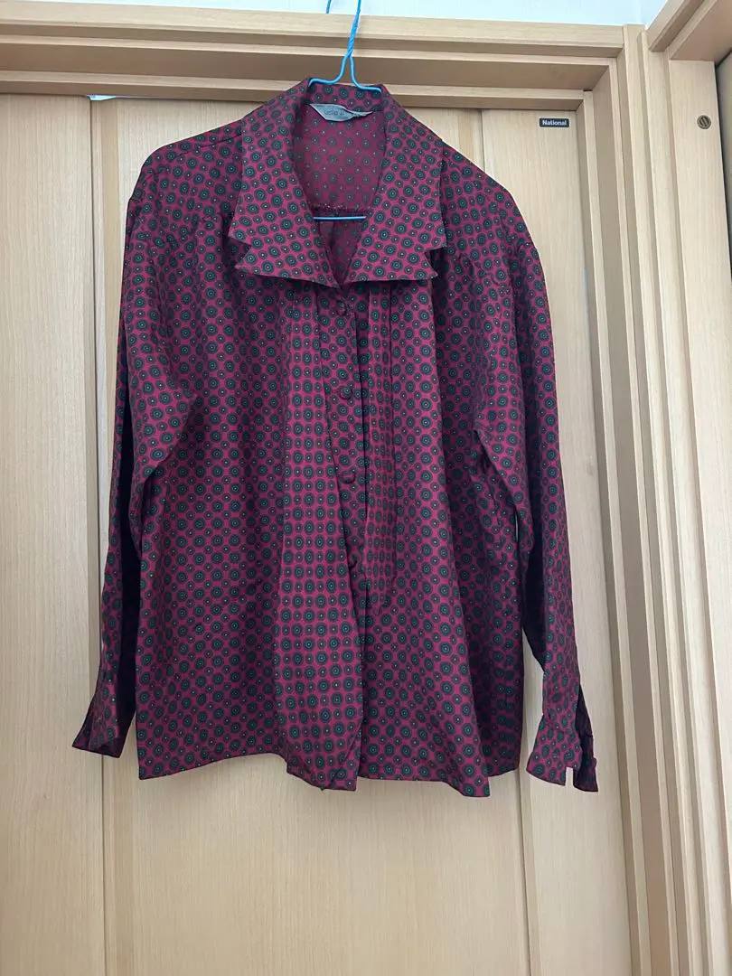 Thumbnail of Long-sleeved blouse with red and black bow tie, 100% polyester, made in Japan